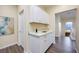 Hallway with white cabinets and luxury vinyl plank flooring at 3846 W Neal Ave, Las Vegas, NV 89141