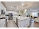 Bright, spacious kitchen with a large island, stainless steel appliances, and pendant lighting at 3846 W Neal Ave, Las Vegas, NV 89141