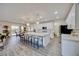 Open kitchen with large island, pendant lighting, and dining area at 3846 W Neal Ave, Las Vegas, NV 89141