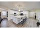 Bright kitchen with white cabinets, stainless steel appliances, and pendant lighting at 3846 W Neal Ave, Las Vegas, NV 89141