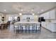 Large kitchen island with barstool seating, white cabinetry, and stainless steel appliances at 3846 W Neal Ave, Las Vegas, NV 89141