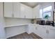 Convenient kitchenette with white cabinets, countertop space, and modern appliances at 3846 W Neal Ave, Las Vegas, NV 89141