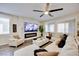 Cozy living room featuring a modern fireplace, white stone wall and comfortable seating at 3846 W Neal Ave, Las Vegas, NV 89141