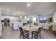 Open-concept living space with kitchen, dining area, and living room for seamless entertaining at 3846 W Neal Ave, Las Vegas, NV 89141