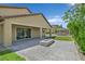 This backyard features a cozy fire pit, built-in grill, and a covered patio at 3870 Valles Caldera Ct, Las Vegas, NV 89118