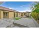 Backyard featuring a built-in bar, artificial turf, and desert landscaping at 3870 Valles Caldera Ct, Las Vegas, NV 89118