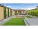 Picturesque backyard with manicured lawn, desert landscaping, and modern hardscaping at 3870 Valles Caldera Ct, Las Vegas, NV 89118