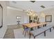 Chic dining room featuring a large table, designer lighting, and an open layout at 3870 Valles Caldera Ct, Las Vegas, NV 89118