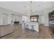 Open kitchen featuring granite countertops, pendant lighting, seating at the island, and stainless steel appliances at 3870 Valles Caldera Ct, Las Vegas, NV 89118
