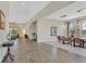 Open-concept living room and dining area showcasing stylish decor and abundant natural light at 3870 Valles Caldera Ct, Las Vegas, NV 89118