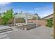 Backyard with pergola, outdoor kitchen, bar seating and desert landscaping at 3870 Valles Caldera Ct, Las Vegas, NV 89118
