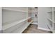 Spacious pantry with ample shelving and stylish flooring at 3870 Valles Caldera Ct, Las Vegas, NV 89118