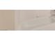 Bathroom features a white bathtub and tiled walls at 3953 Rebecca Raiter Ave # 101, Las Vegas, NV 89110