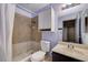 Tiled bathroom with shower-tub combo, modern fixtures, and updated vanity at 441 N Lamb Blvd # E, Las Vegas, NV 89110