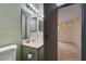 Bathroom features a toilet, sink and vanity, and open doorway to the bedroom at 441 N Lamb Blvd # E, Las Vegas, NV 89110