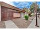 Street view of the exterior with security gate and desert landscaping at 441 N Lamb Blvd # E, Las Vegas, NV 89110