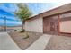 Street view of the exterior with security gate and desert landscaping at 441 N Lamb Blvd # E, Las Vegas, NV 89110