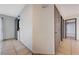 Hallway featuring tile floors and leads to rooms, with laundry area at 441 N Lamb Blvd # E, Las Vegas, NV 89110
