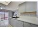 Beautiful kitchen with grey cabinets, quartz countertops, undermount sink, and stainless steel appliances at 441 N Lamb Blvd # E, Las Vegas, NV 89110