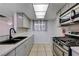 Well-lit kitchen with quartz countertops, stainless steel appliances, and undermount sink at 441 N Lamb Blvd # E, Las Vegas, NV 89110