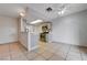 Open concept kitchen features modern appliances, white countertops, tile flooring and plenty of natural light at 441 N Lamb Blvd # E, Las Vegas, NV 89110