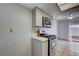 Updated kitchen with tile floors, stainless steel range, and modern cabinetry at 441 N Lamb Blvd # E, Las Vegas, NV 89110