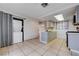 Updated kitchen with modern appliances, light gray cabinets, and convenient washer-dryer setup at 441 N Lamb Blvd # E, Las Vegas, NV 89110