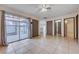 Bright living room with sliding glass doors to patio, tile flooring, and multiple entryways at 441 N Lamb Blvd # E, Las Vegas, NV 89110