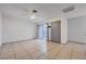 Bright living room featuring neutral paint, tile floors, and access to patio at 441 N Lamb Blvd # E, Las Vegas, NV 89110