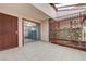 A lovely outdoor patio area featuring tile flooring, garden decor, and secure gating for privacy and security at 441 N Lamb Blvd # E, Las Vegas, NV 89110