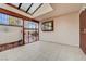 Enclosed patio featuring tile flooring, skylight, and secure gated access at 441 N Lamb Blvd # E, Las Vegas, NV 89110