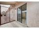 A partially enclosed patio offers an outside gate and sliding glass door at 441 N Lamb Blvd # E, Las Vegas, NV 89110