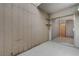 Covered patio with wood paneling, open ceiling, and sliding glass door access to inside at 441 N Lamb Blvd # E, Las Vegas, NV 89110