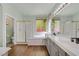 Bathroom featuring a soaking tub, glass-enclosed shower, and double sinks at 4432 Vicobello Ave, Las Vegas, NV 89141