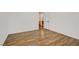 Neutral bedroom with wood-look floors and a door leading to the bathroom at 4432 Vicobello Ave, Las Vegas, NV 89141