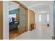 Open hallway leading to various rooms, highlighting the home's layout and design at 4432 Vicobello Ave, Las Vegas, NV 89141