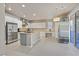 Modern kitchen with stainless steel appliances, a large island, and ample counter space at 4432 Vicobello Ave, Las Vegas, NV 89141