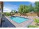 Backyard swimming pool, elevated hot tub, and patio enhance this outdoor living space at 4432 Vicobello Ave, Las Vegas, NV 89141