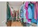 Spacious walk-in closet with built-in storage and various clothing racks for optimal organization at 4432 Vicobello Ave, Las Vegas, NV 89141