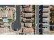 Bird's-eye view of a neighborhood featuring well-maintained homes with tiled roofs and manicured lawns in a planned community at 4707 Pink Jasper Ct, Las Vegas, NV 89141