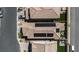 High angle image of home with a tile roof and solar panels plus an outdoor living area featuring a green lawn at 4707 Pink Jasper Ct, Las Vegas, NV 89141