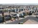 This is an elevated neighborhood showcasing neatly arranged homes with tile roofs and neutral tones, set against a desert backdrop at 4707 Pink Jasper Ct, Las Vegas, NV 89141