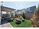 Backyard featuring an outdoor kitchen, seating area, and play area, perfect for Gathering fun and entertaining at 4707 Pink Jasper Ct, Las Vegas, NV 89141