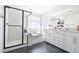 Bright bathroom with a glass-enclosed shower, soaking tub, and modern vanity, creating a spa-like experience at 4707 Pink Jasper Ct, Las Vegas, NV 89141