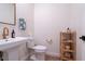 Stylish half bathroom featuring a modern vanity and decor at 4707 Pink Jasper Ct, Las Vegas, NV 89141