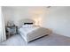 Bright bedroom with a comfortable bed, desk, and soft lighting, designed for peaceful rest at 4707 Pink Jasper Ct, Las Vegas, NV 89141