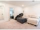 Upstairs bonus room with plush carpeting and comfortable seating area at 4707 Pink Jasper Ct, Las Vegas, NV 89141