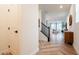 Inviting entryway with beautiful wood-look floors, open staircase and views of the living room space at 4707 Pink Jasper Ct, Las Vegas, NV 89141