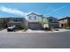 Charming two-story home features a neutral color scheme, brick accents and a paved driveway at 4707 Pink Jasper Ct, Las Vegas, NV 89141