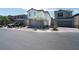 Two-story home shows great curb appeal with a neutral color palette, brick accents, and an attached garage at 4707 Pink Jasper Ct, Las Vegas, NV 89141
